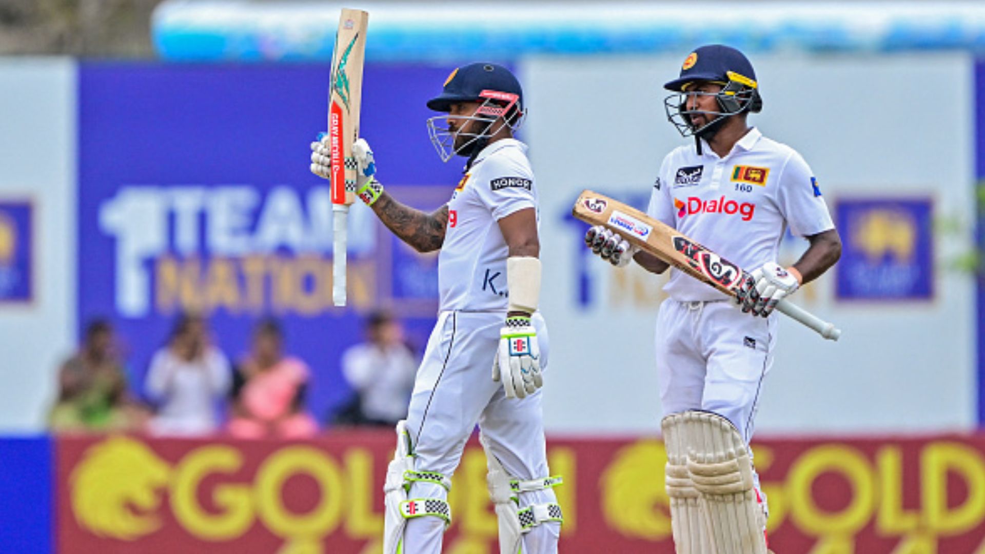 SL vs NZ, 2nd Test: Kiwis left reeling with 22/2 after Sri Lanka declare innings at 602/5 riding on Kamindu Mendis' record-making century Sri Lanka's Kusal Mendis (L) celebrates after scoring a half-century as his teammate Kamindu Mendis looks on during Day 2 of the second Test against New Zealand at the Galle International Cricket Stadium on September 27. (Getty)