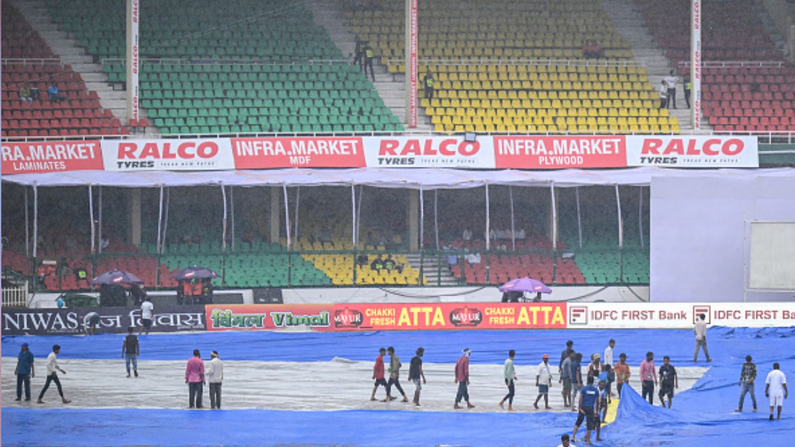 IND vs BAN: Day 2 of India vs Bangladesh 2nd Test washed out without a bowl being bowled due to persistent rain in Kanpur Groundsmen cover the field as rain delays the start of the second day play of the second Test cricket match between India and Bangladesh at the Green Park Cricket Stadium in Kanpur on September 28, 2024. (Getty)