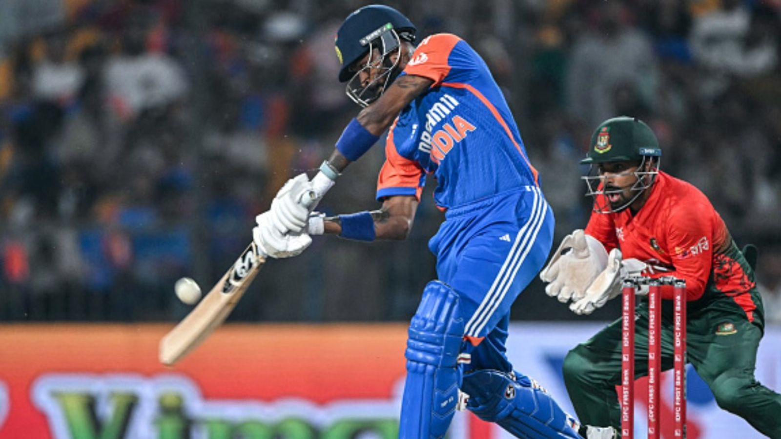 IND vs BAN: Varun-Arshdeep's bowling wizardry coupled with Hardik's all-round show steer India to 7-wicket win over Bangladesh in 1st T20I India's Hardik Pandya (L) plays a shot during the first T20I against Bangladesh in Gwalior on October 6, 2024. (Getty)