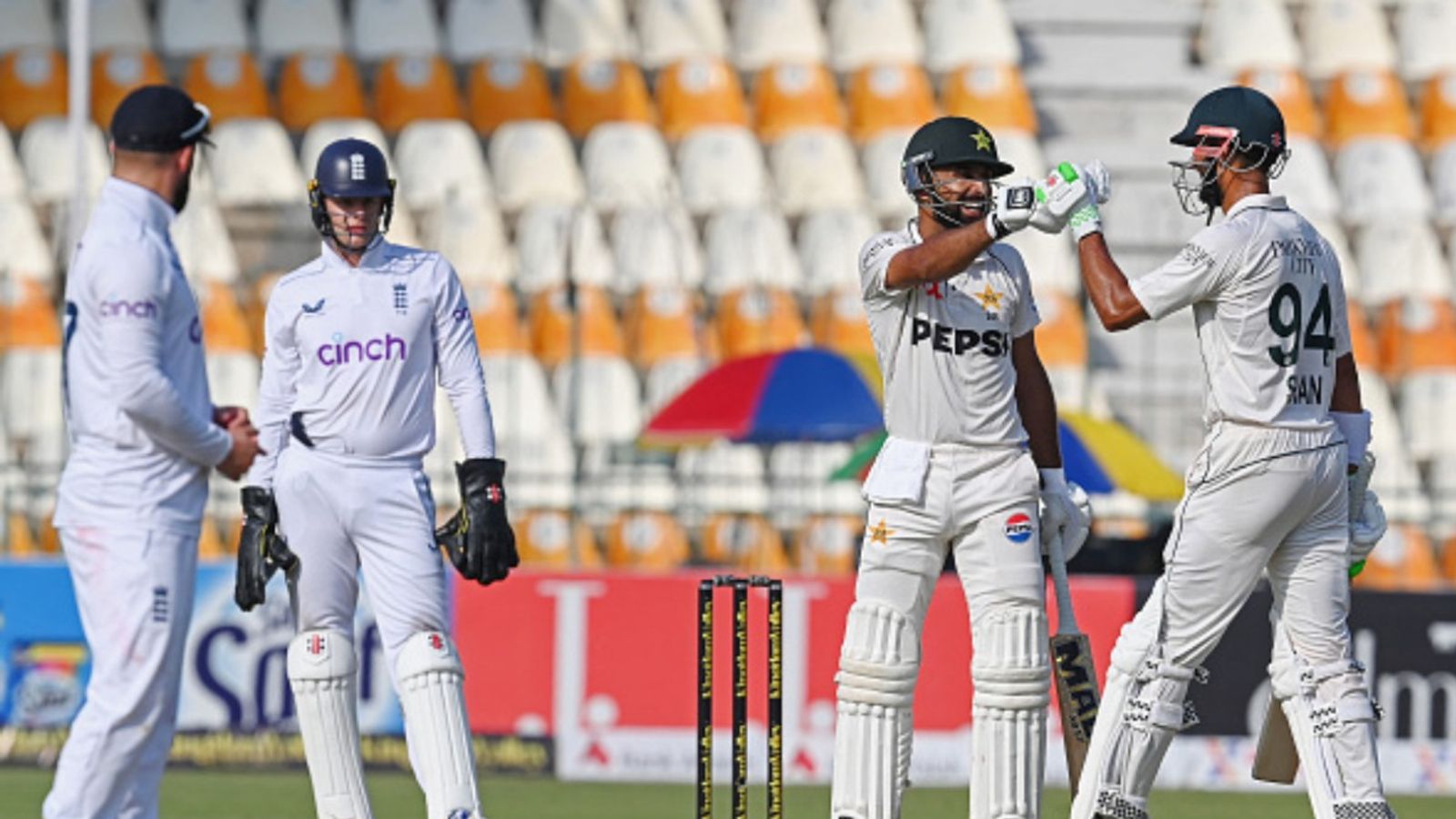 PAK vs ENG, 1st Test: Shan Masood's 151, Abdullah Shafique's 102 propel Pakistan to strong 328/4 against England on 'dead' Multan pitch Pakistan's Abdullah Shafique (2R) celebrates wtih his captain Shan Masood (R) after scoring a century during the first day of the first Test against England on October 7. (Getty)