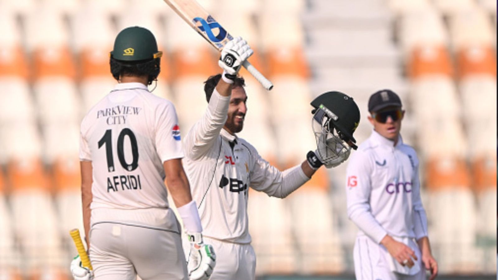 PAK vs ENG, 1st Test: Salman Ali Agha's 104 catapults Pakistan to mammoth 556 before England finish Day 2 strongly on 96/1 Pakistan batter Salman Ali Agha celebrates his century as Ollie Pope looks on during Day 2 of the first Test against England at Multan Cricket Stadium on October 8. (Getty)