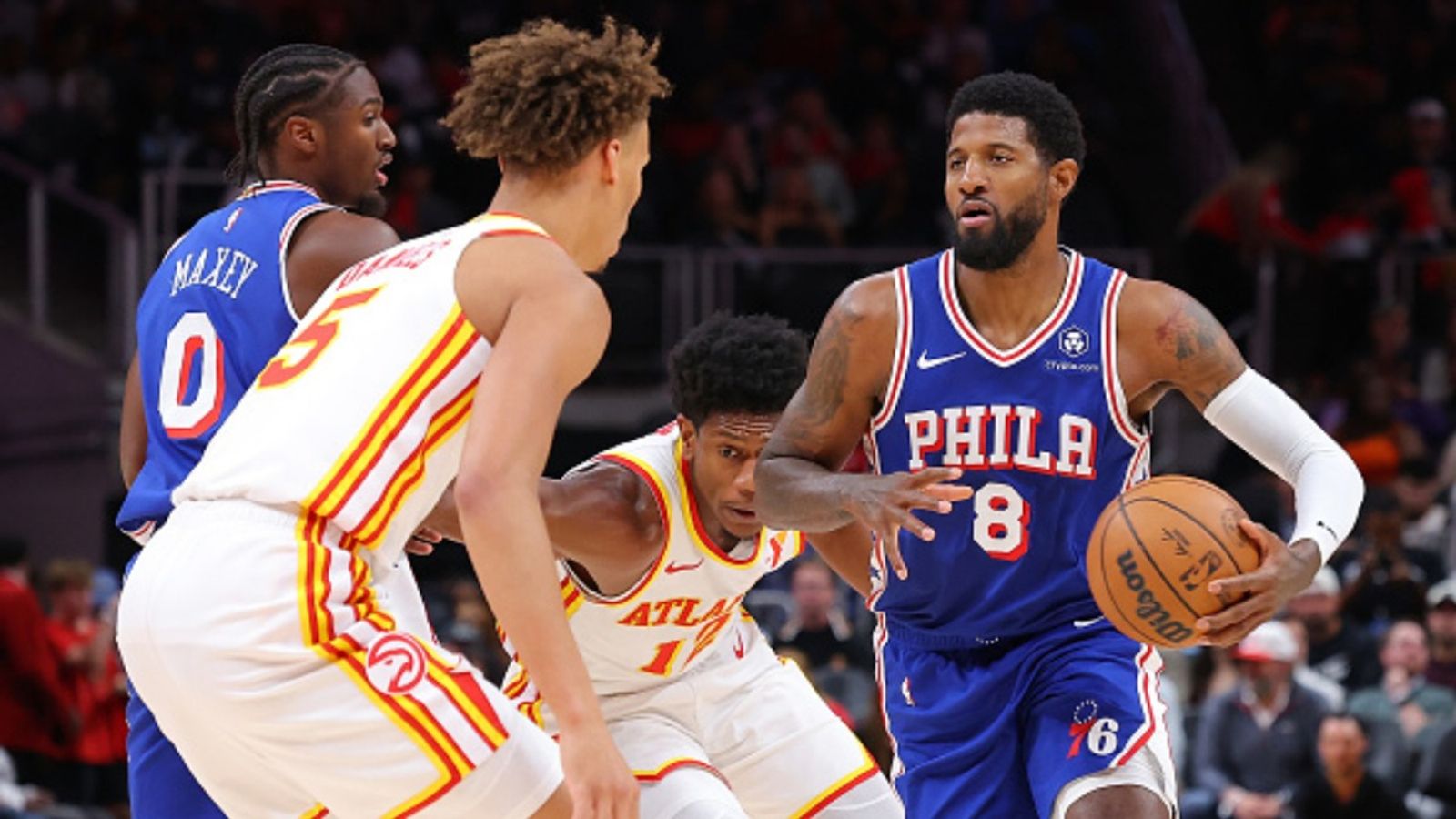 Nine-time All star suffers knee injury in second NBA pre-season game with Philadelphia 76ers Paul George #8 of the Philadelphia 76ers drives against De'Andre Hunter #12 and Dyson Daniels #5 of the Atlanta Hawks during the first quarter at State Farm Arena on October 14, 2024 in Atlanta, Georgia.