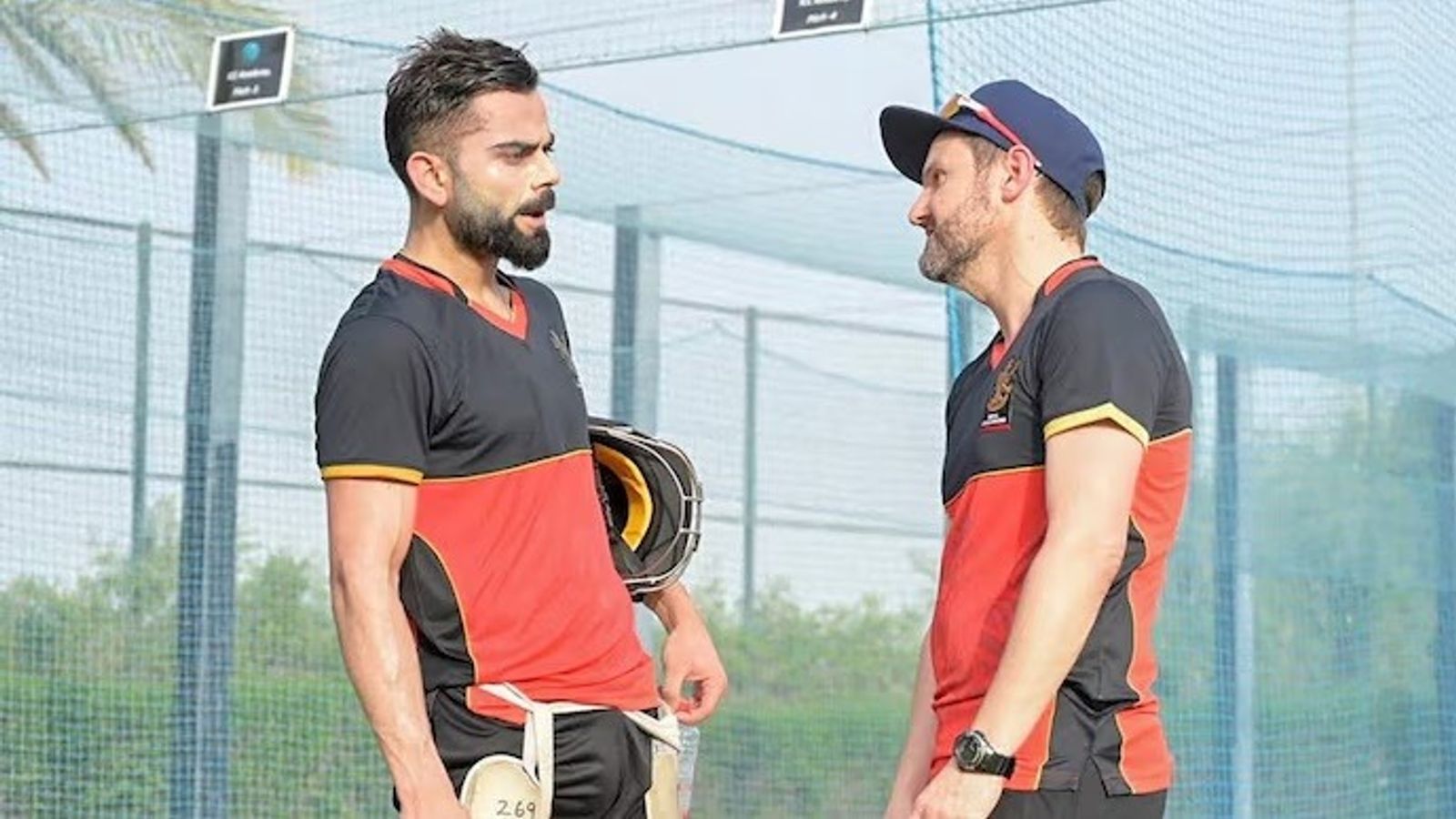 'I think that's a dangerous stage for other sides': Former RCB coach cautions Australia about Virat Kohli weeks ahead of Border-Gavaskar Trophy Virat Kohli during a conversation in the nets with former RCB coach Mike Hesson