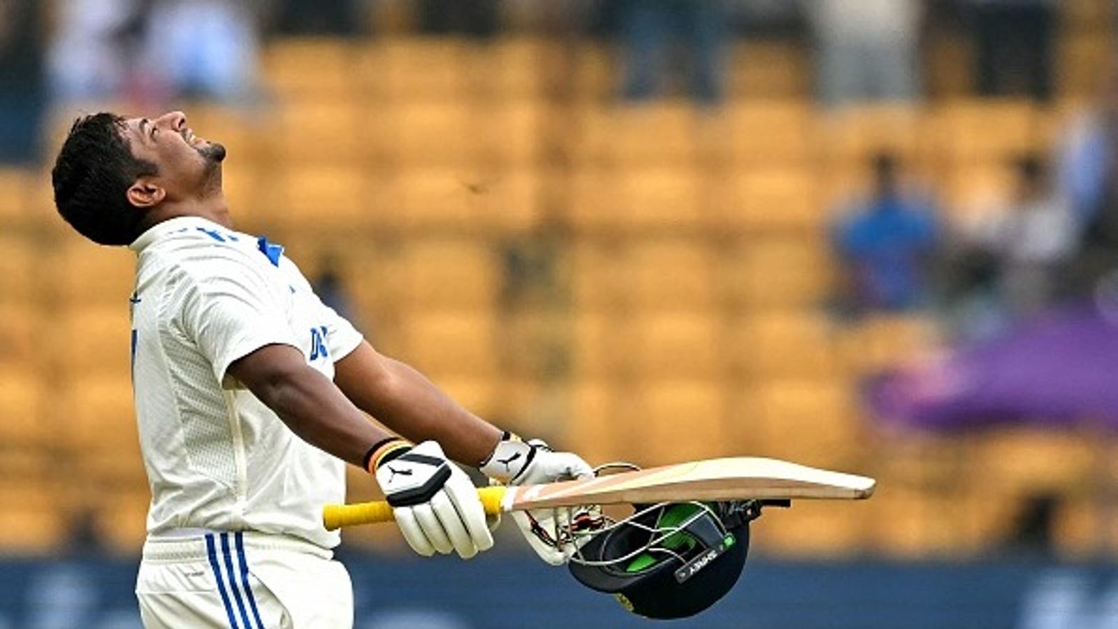 Domestic giant Sarfaraz Khan scores maiden Test ton after duck in 1st innings, equals Shikhar Dhawan's unique decade-old feat against New Zealand India's Sarfaraz Khan celebrates after scoring a century during the fourth day of the first Test cricket match against New Zealand at the M. Chinnaswamy Stadium in Bengaluru