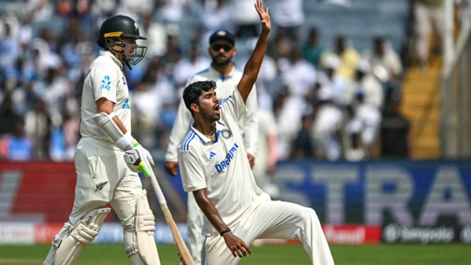 IND vs NZ: India in deep trouble as New Zealand tighten grip on 2nd Test with 301-run lead after Mitchell Santner's 7-fer bulldoze hosts for 156 on Day 2 India's Washington Sundar (centre) while making an appeal in this frame.