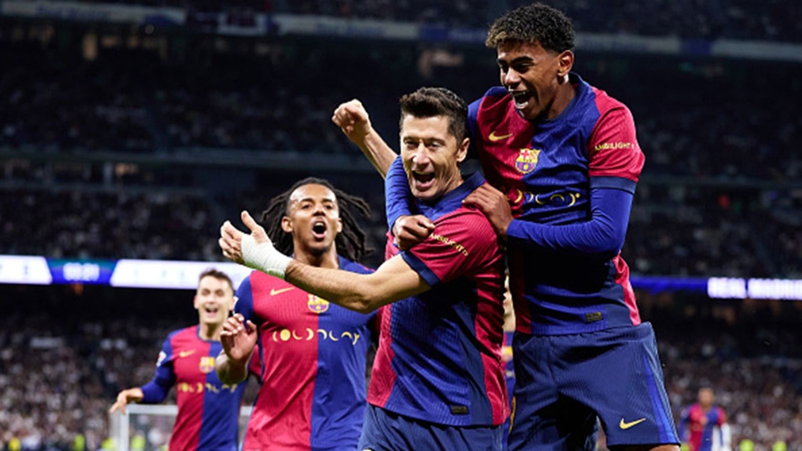 Lamine Yamal breaks 77-year-old El Clasico record as Barcelona end Real Madrid's 42-game unbeaten streak with one-sided 4-0 win Robert Lewandowski of FC Barcelona celebrates after scoring their side's first goal with his teammate Lamine Yamal during the LaLiga match against Real Madrid CF at Estadio Santiago Bernabeu