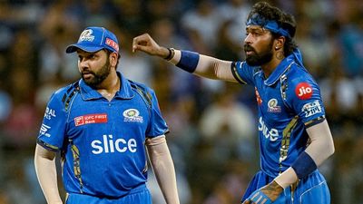 EXPLAINED: Why Rohit Sharma agreed to take the lowest salary among Mumbai Indians' top four picks in IPL 2025 retention? Know here Mumbai Indians' captain Hardik Pandya (R) gestures as Rohit Sharma looks on in this frame