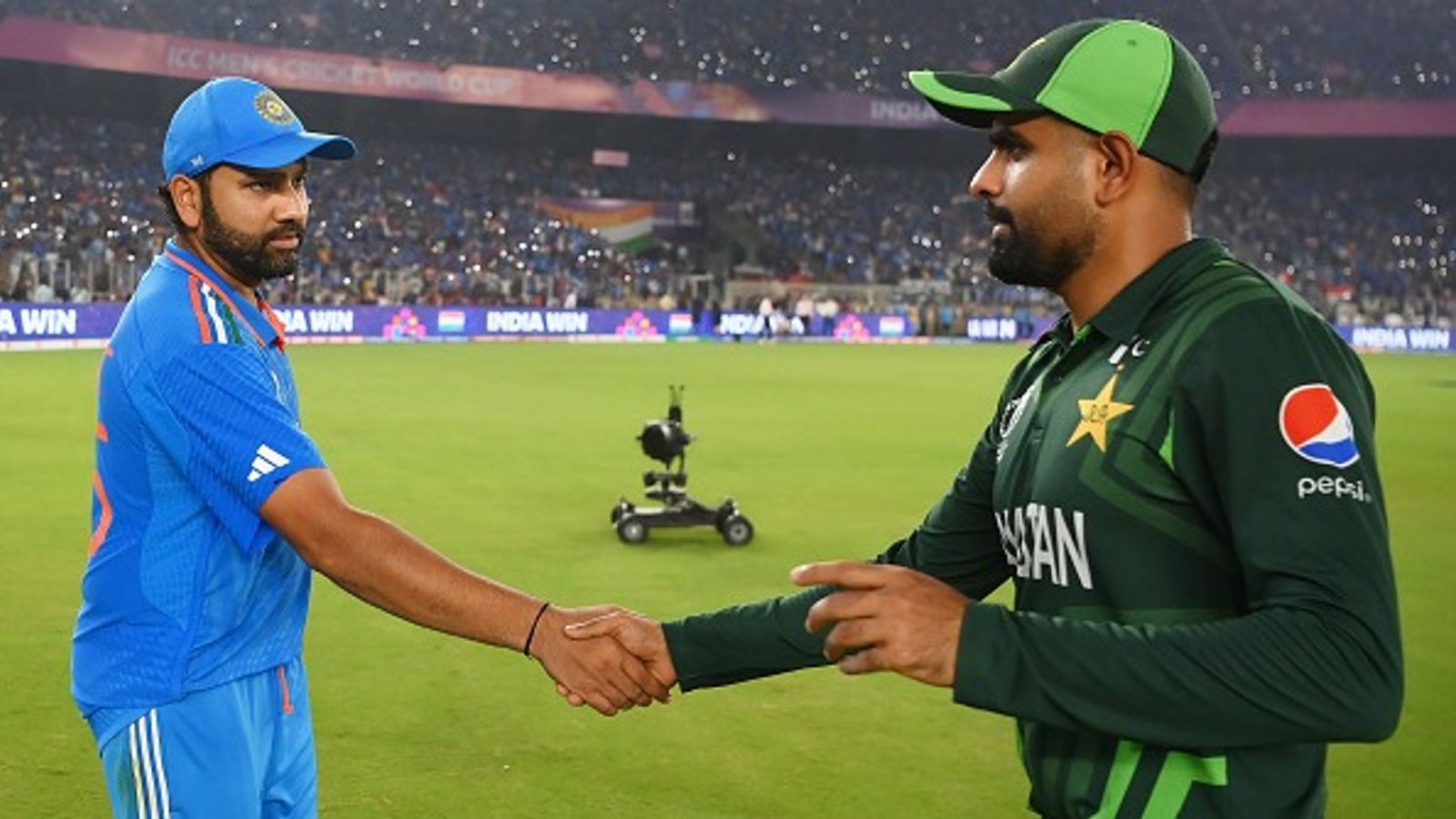 PCB surrenders to BCCI's demand to host Champions Trophy 2025 in hybrid model, sensational report reveals venues for India's matches Pakistan's Babar Azam shakes hands with India captain Rohit Sharma
