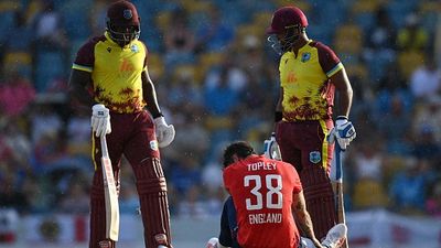 ICC slaps England star with hefty fine for chair-smashing outburst during first T20I against West Indies England's Reece Topley lies on the ground after falling after bowling during the 1st T20I against West Indies.