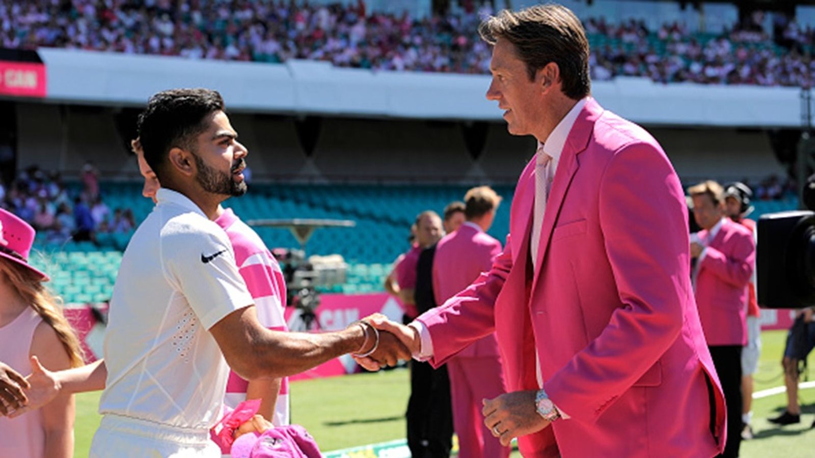 Glenn McGrath wants Australian bowlers to target an 'emotional' Virat Kohli, 'If they go hard at him, if he gets in the fight...' Virat Kohli of India presents Glenn McGrath his pink Test cap during day three of the fourth Test match between Australia and India at Sydney Cricket Ground on January 8, 2015.