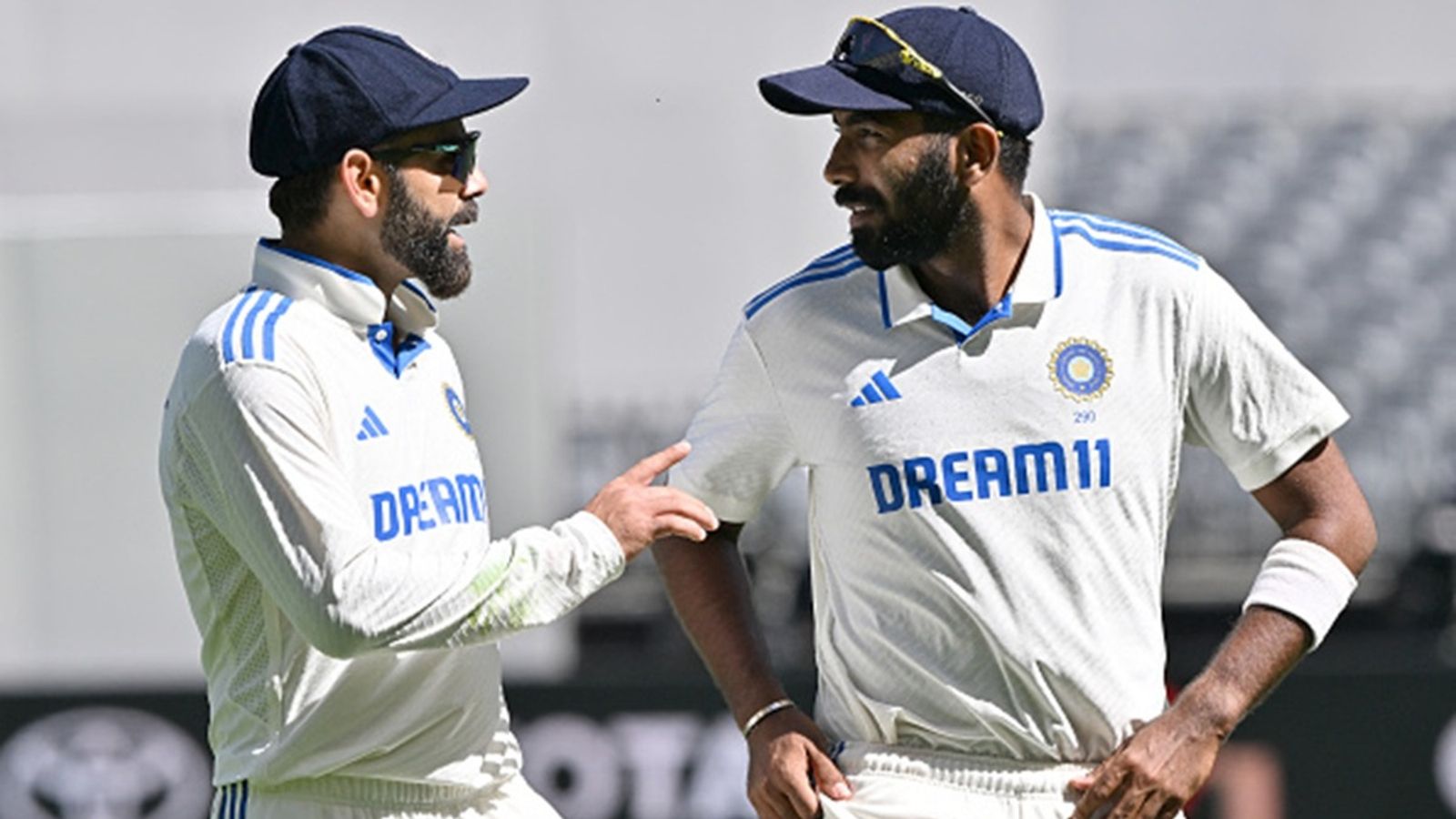 'I didn't see Virat out of form. On challenging wickets...': Jasprit Bumrah on Virat Kohli not scoring big against New Zealand India's skipper Jasprit Bumrah (R) and Virat Kohli (L) speak as they walk back to the pavilion at the tea break on day four of the first Test at Optus Stadium in Perth on November 25, 2024.