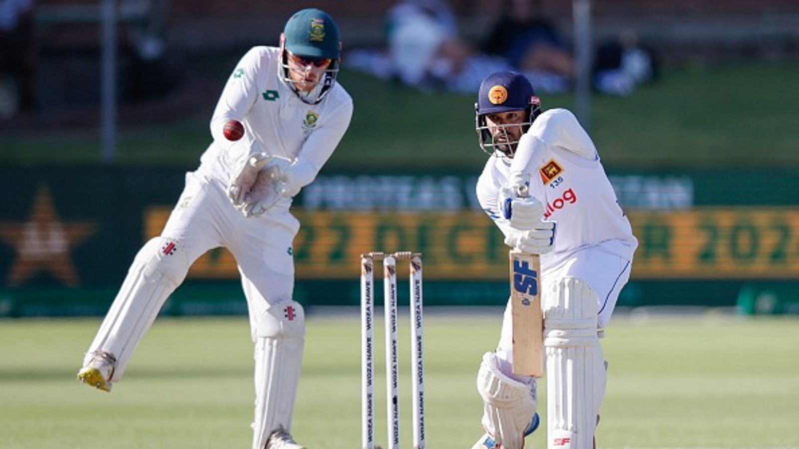 SA vs SL: Sri Lanka poised at 205/5 in pursuit of 348-run target while South Africa just 5 wickets away from sealing 2nd Test and series Sri Lanka's Dhananjaya de Silva (R) plays a shot as South Africa's wicketkeeper Kyle Verreynne (L) collects the ball during Day 4 of the 2nd Test