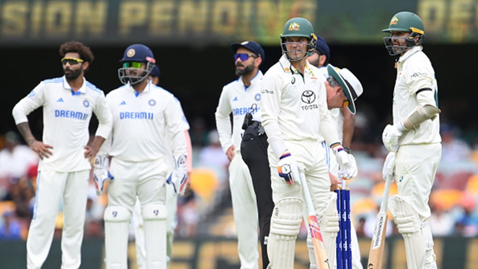 Jasprit Bumrah registers record-breaking six-fer but Alex Carey's fighting 70 leads Australia to 445 after Steve Smith, Travis Head's tons on Day 2 Alex Carey of Australia and Nathan Lyon of Australia watch the big screen reply during day three of the Third Test match in the series between Australia and India at The Gabba on December 16, 2024 in Brisbane.