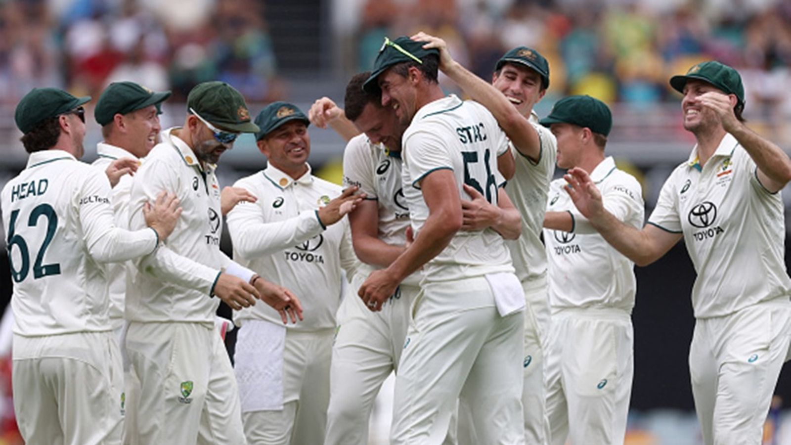 Big blow to Australia amidst Gabba Test, star bowler leaves field and taken for scans after bowling just one over on Day 4 Australia's Josh Hazlewood (C) celebrates the wicket of India's Virat Kohli with teammates on day three of the third Test match between Australia and India at The Gabba in Brisbane on December 16, 2024.