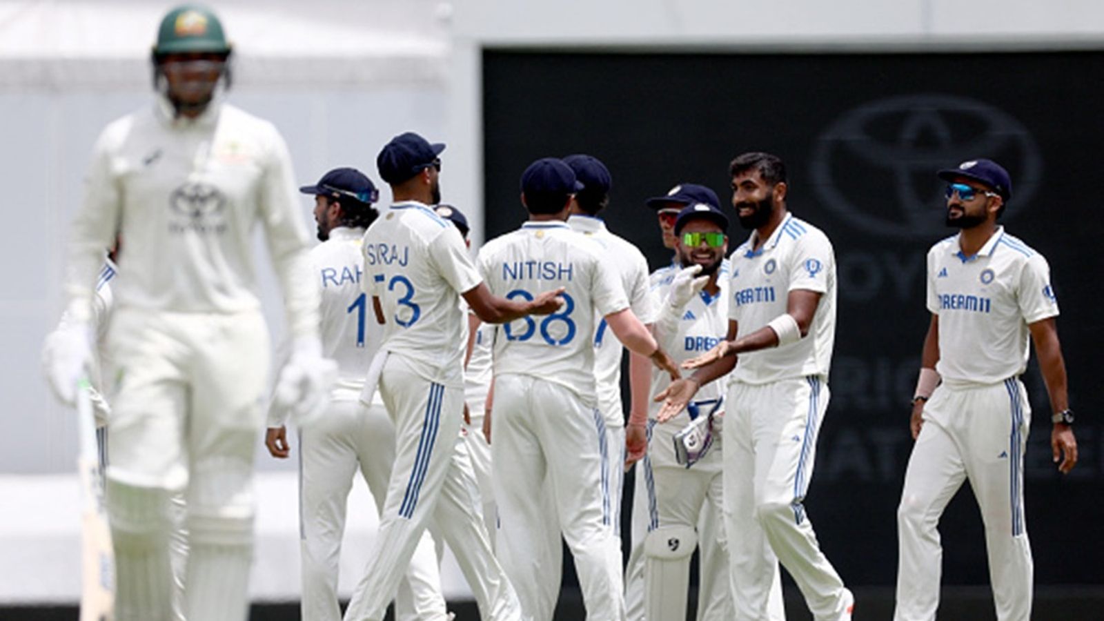 India's 'Gabba Ghamand' intact amidst incessant rain as third Test ends in a draw, WTC final chances remain alive India's Jasprit Bumrah (R) celebrates with teammates after bowling Australia's Usman Khawaja (L) on day five of the third cricket Test match between Australia and India at The Gabba in Brisbane on December 18.