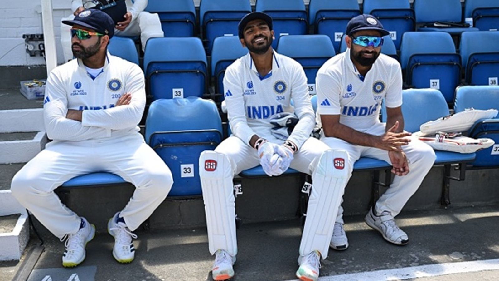 'I think it's high time somebody from NCA talked about him': Rohit Sharma's blunt response on why Mohammed Shami is not part of Test squad in Australia India's wicketkeeper KS Bharat (C) and Mohammed Shami (R) share a light moment as captain Rohit Sharma (L) looks on during a break in play on day 4 of the ICC World Test Championship cricket final match between Australia and India at The Oval, in London.