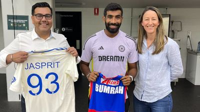 Indian Cricket vice-captain Jasprit Bumrah exchange Jerseys with AFL's Western Bulldogs at MCG Jasprit Bumrah in the frame along with AFL team members