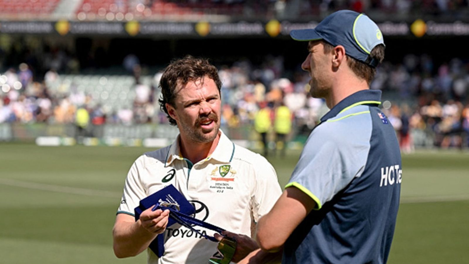 'Maybe around fielding, if he's a bit uncomfortable': Pat Cummins confirms Travis Head for Boxing Day Test but provides vital fitness udpate Australia's Travis Head (L) talks with captain Pat Cummins on the third day of the second cricket Test match between Australia and India at the Adelaide Oval in Adelaide on December 8, 2024.