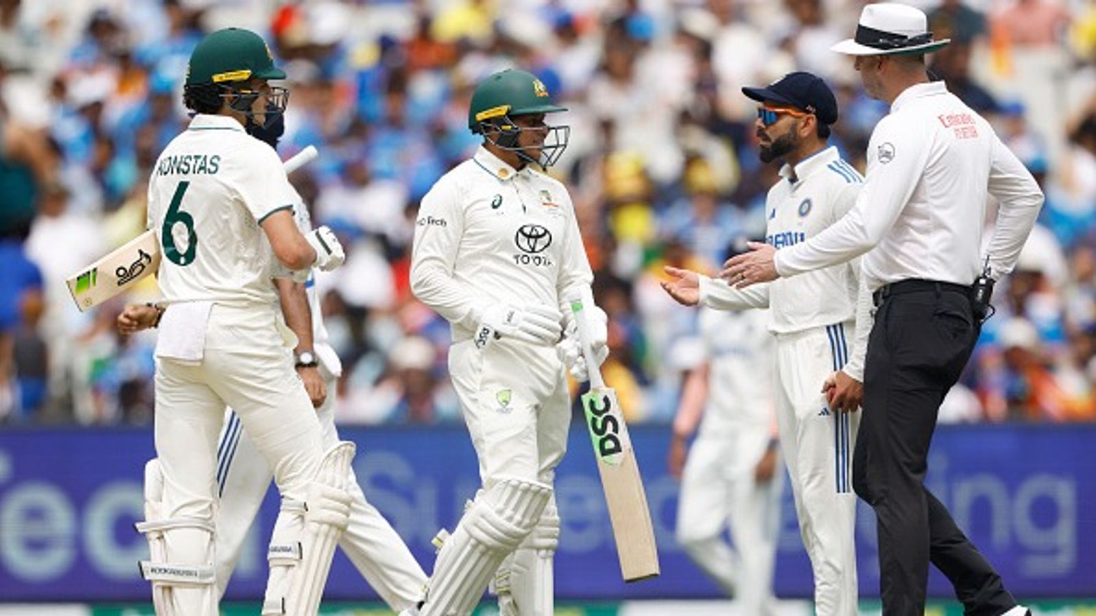 Usman Khawaja reveals how he diffused the heated exchange between Virat Kohli and Sam Konstas, says 'I didn't want to be tainted by any...' India's Virat Kohli (2R) chats with Australia's Sam Konstas and Usman Khawaja during Day 1 of 4th Test at MCG