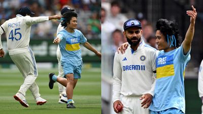 Fan invades field in MCG on Day 2 of Boxing Day Test, almost tackles Rohit Sharma and puts hands around Virat Kohli shoulders - WATCH Fan invades field on Day 2 of MCG Test