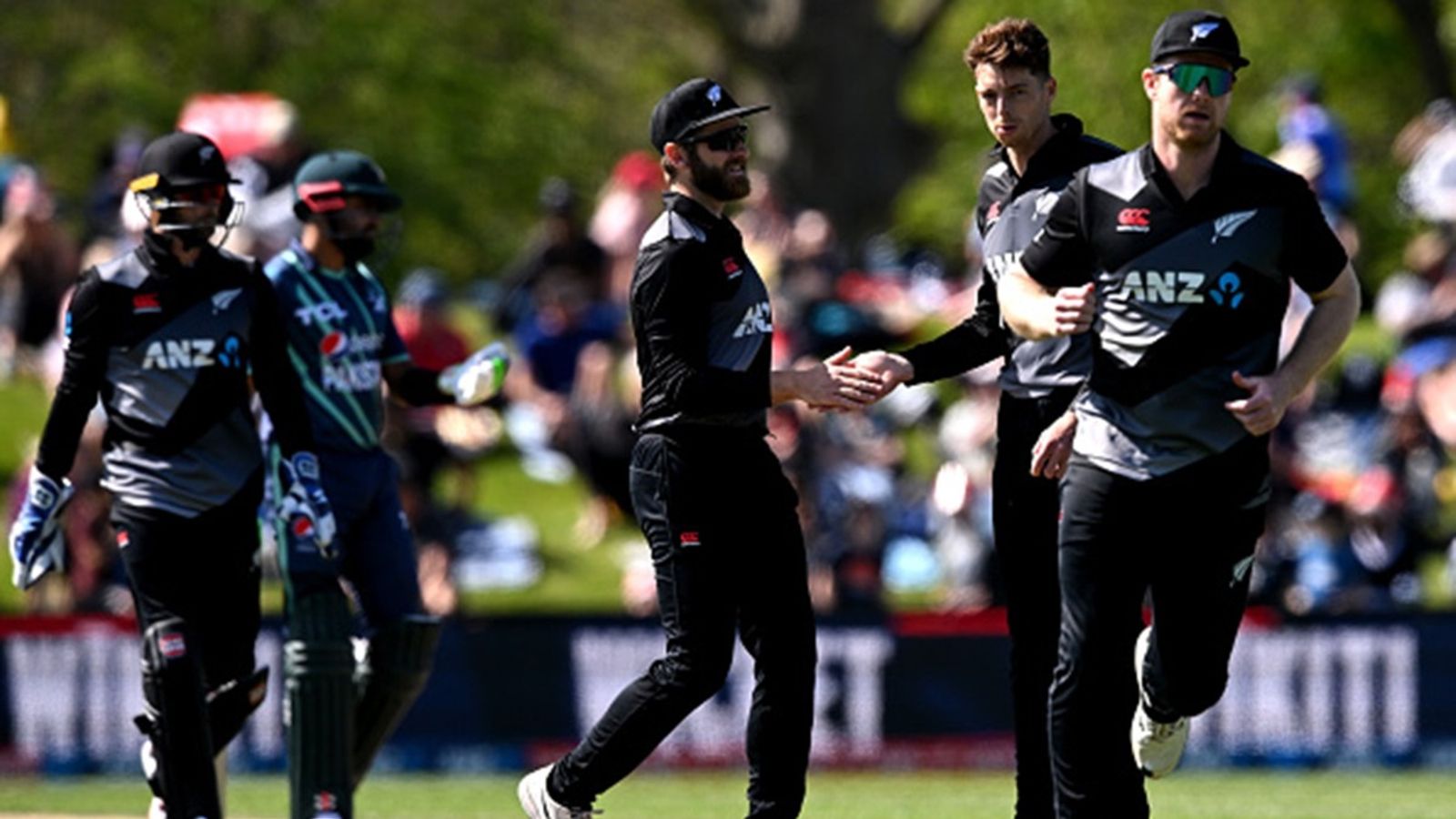New Zealand announce squad for ICC Champions Trophy 2025 and Tri-Series in Pakistan featuring 5 pacers Kane Williamson and Mitchell Santner of New Zealand celebrate the wicket of Shan Masood during game four of the T20I series at Hagley Oval on October 11, 2022 in Christchurch.