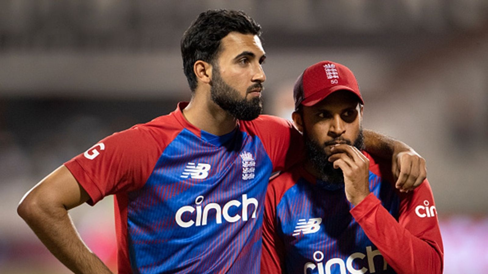 Pakistan-origin England cricketer faces visa issues, ECB forced to cancel flight ahead of T20I series against India: Report England team mates Saqib Mahmood and Adil Rashid wait for the presentation after the 3rd T20I between England and Pakistan at Emirates Old Trafford on July 20, 2021 in Manchester.