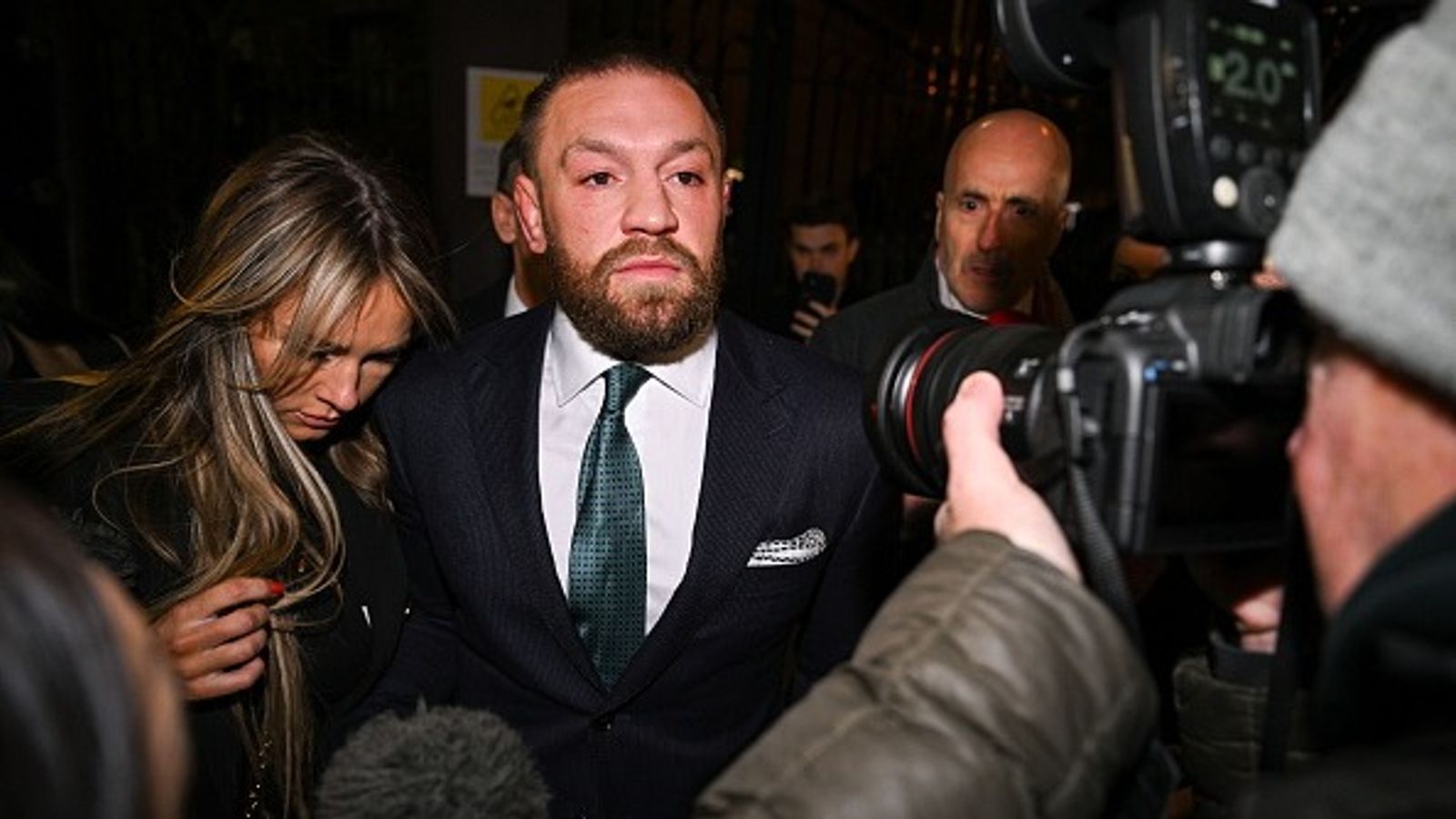 Conor McGregor Faces Fresh Lawsuit of Sexually Assaulting a Woman During NBA 2023 Finals Conor McGregor leaves court, accompanied by his partner Dee Devlin.