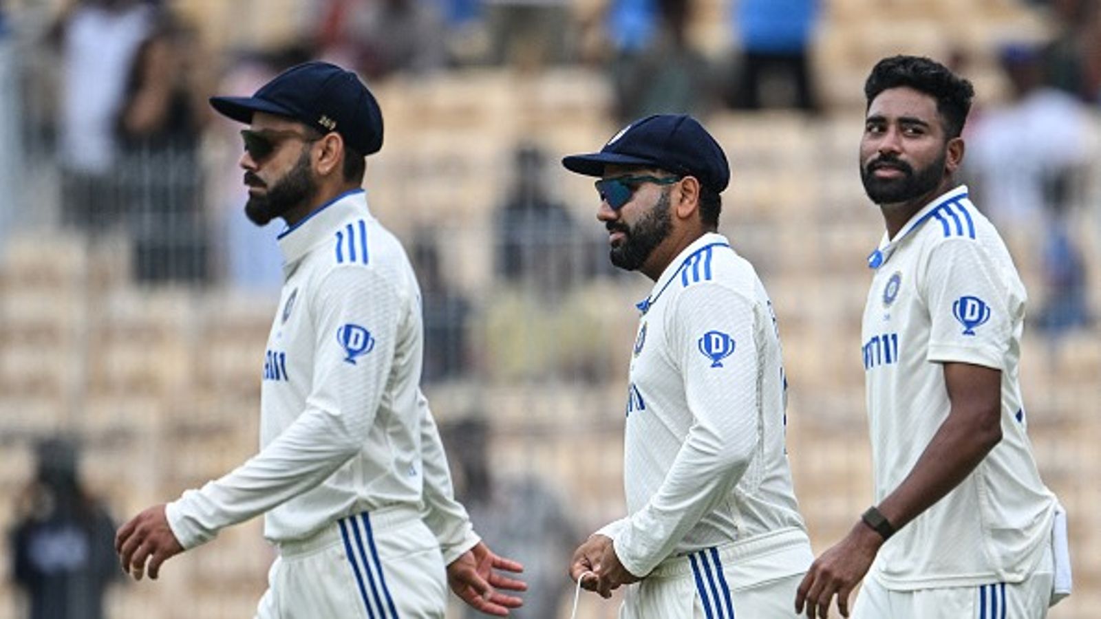 Exclusive: BCCI announces strict policy for Indian cricketers in massive crackdown on issues of indiscipline; Know all 10 key points here From left: India's captain Rohit Sharma with his teammates Virat Kohli (L) and Mohammed Siraj in frame
