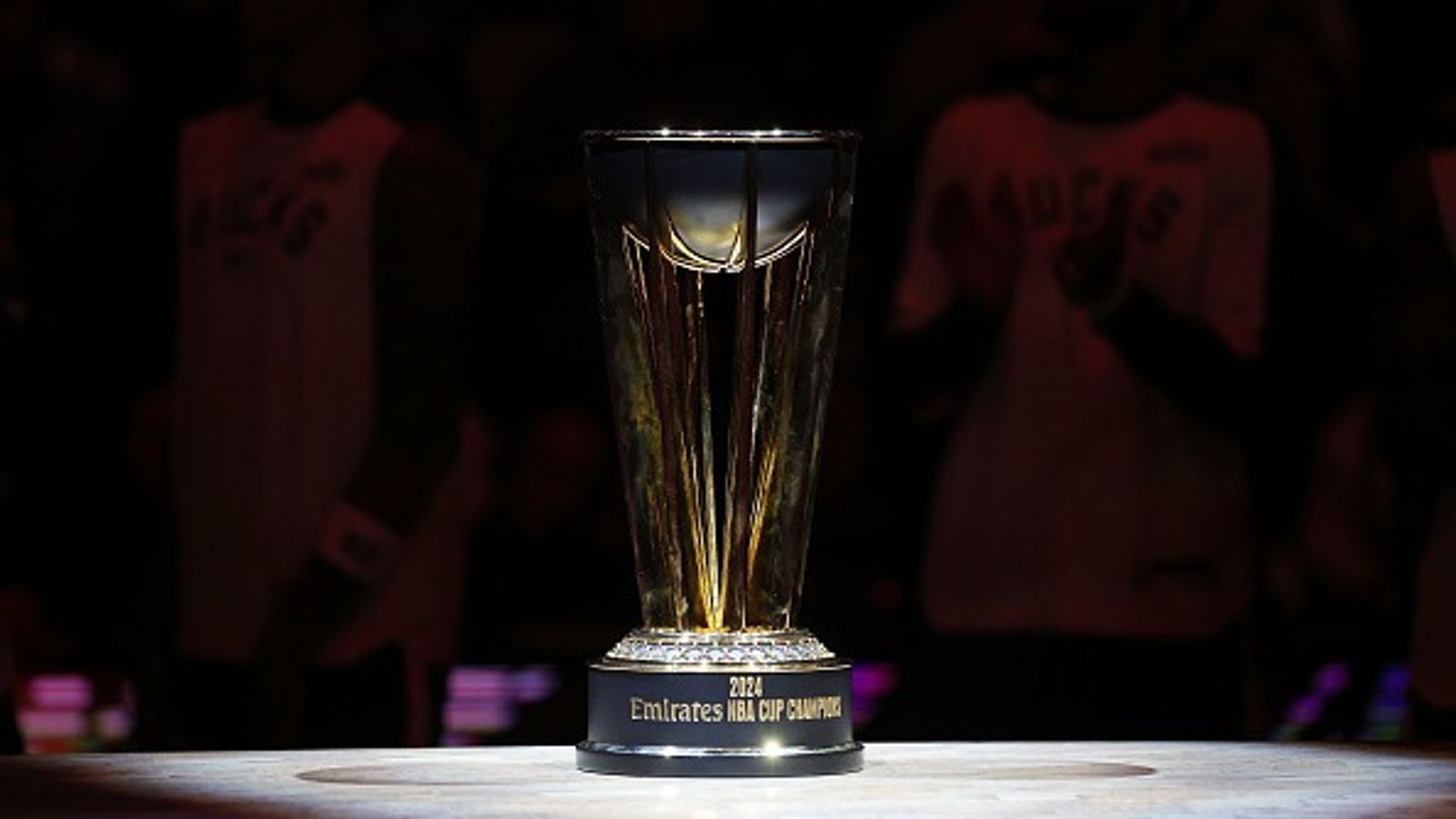 Former Mavericks Star Attempting NBA Comeback, Signs With G League NBA Trophy in the frame.
