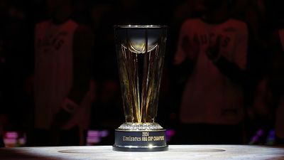 Former Mavericks Star Attempting NBA Comeback, Signs With G League NBA Trophy in the frame.