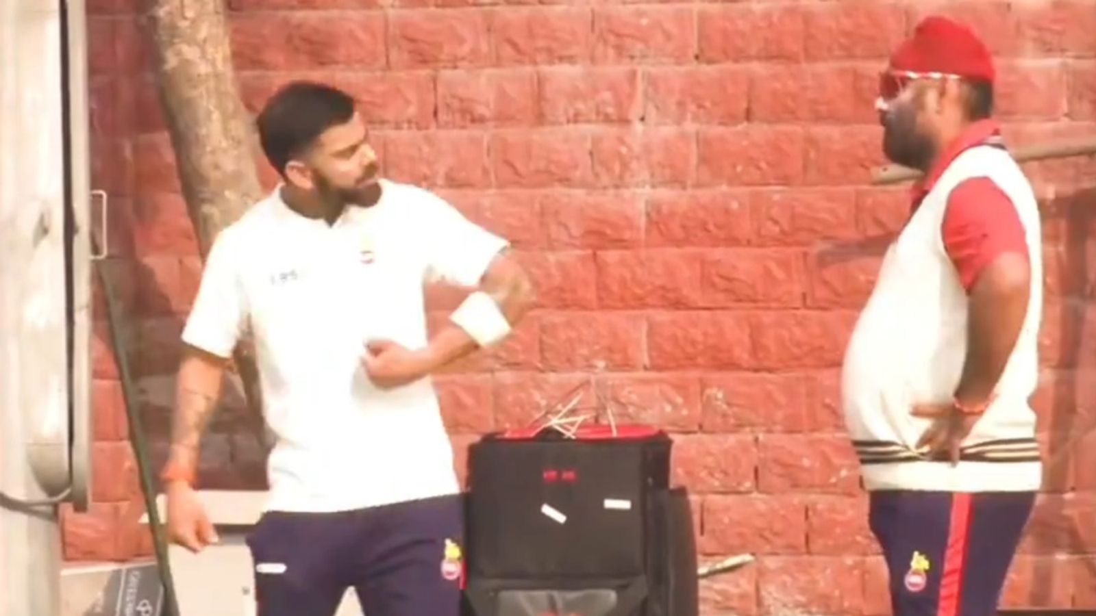 Will Virat Kohli return to Ranji Trophy next season? Delhi coach says, 'He loves and wants to play domestic cricket but...' Virat Kohli talks to Delhi coach Sarandeep Singh.