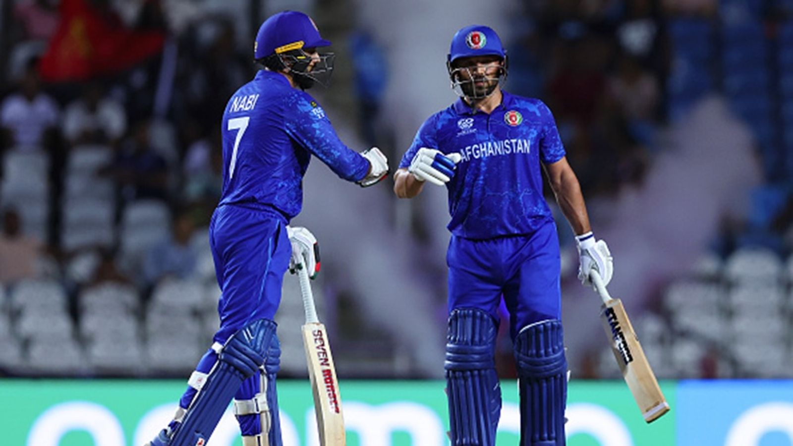 Afghanistan player takes U-turn on ODI retirement, wants to fulfill his dream to play alongside his 18-year-old son Gulbadin Naib and Mohammad Nabi of Afghanistan fist bump during the ICC Men's T20 Cricket World Cup West Indies & USA 2024 match against Papua New Guinea at Brian Lara Cricket Academy on June 13, 2024 in Tarouba, Trinidad And Tobago.