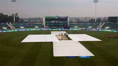 What happens if Afghanistan vs Australia clash washed out? Champions Trophy qualification scenario explained The covers protect the pitch as rain falls ahead of the ICC Champions Trophy 2025 group match