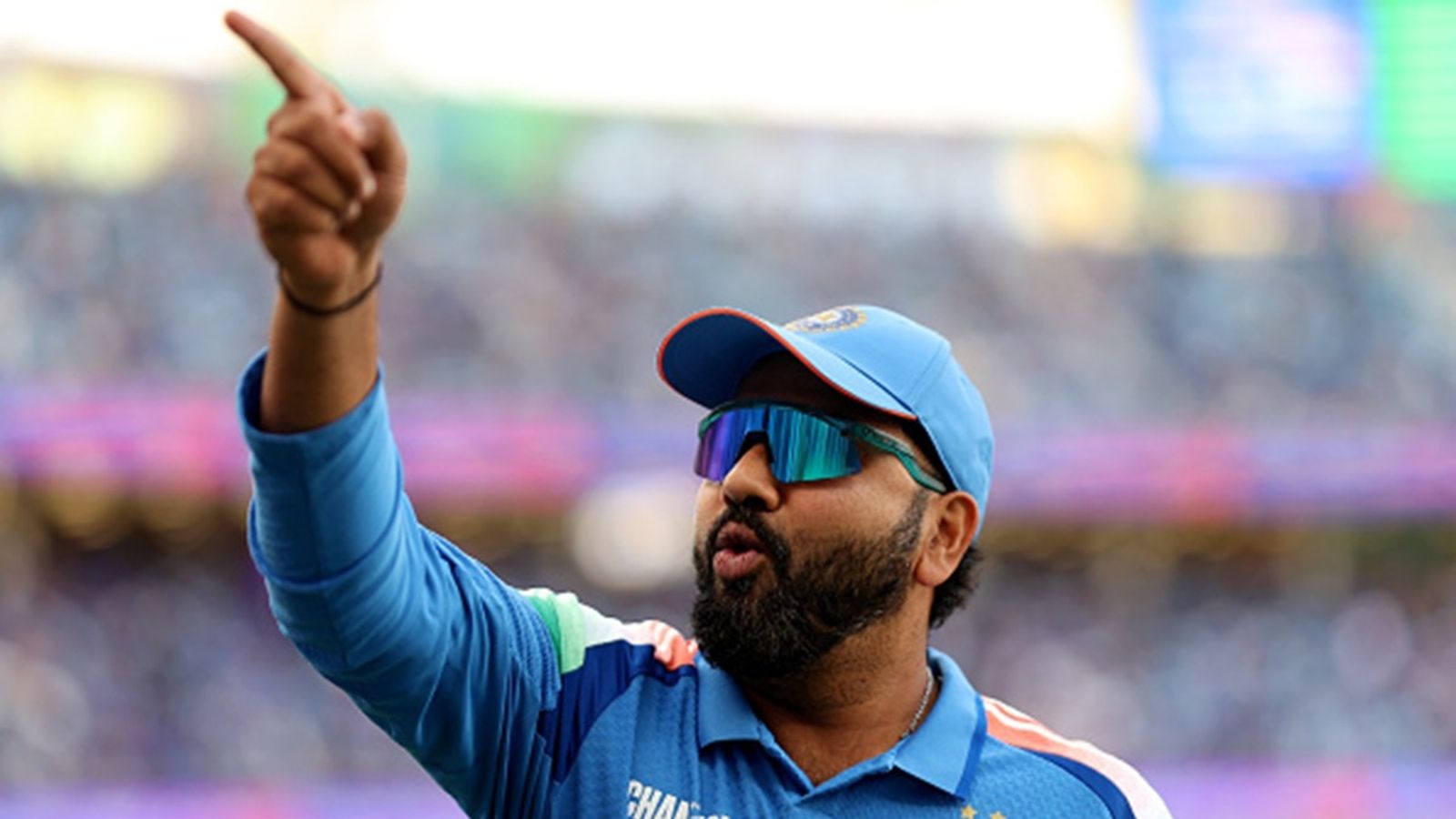 'This is not hour home, this is Dubai. We don't play so many...': Rohit Sharma's strong retort to criticism over India playing Champions Trophy 2025 at one venue Rohit Sharma of India gestures as players of India prepare to field during the ICC Champions Trophy 2025 match against New Zealand Dubai International Cricket Stadium on March 02, 2025 in Dubai, United Arab Emirates.