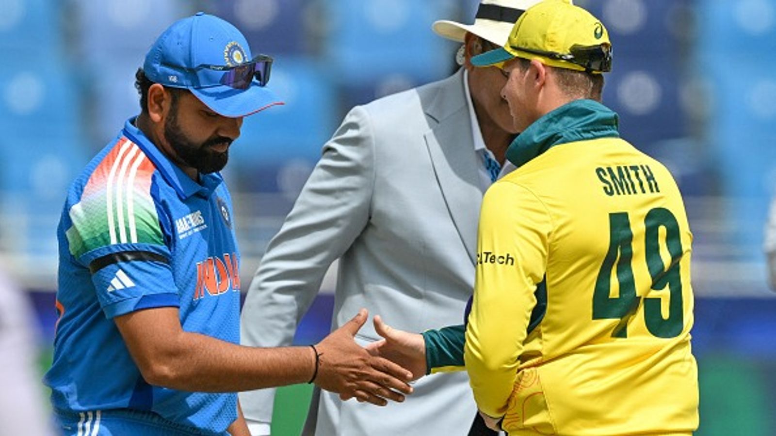 Why Rohit Sharma-led Team India wearing black armbands during Champions Trophy 2025 semifinal clash against Australia? Rohit Sharma and Steve Smith shaking hands during toss at Champions Trophy 2025 semifinal
