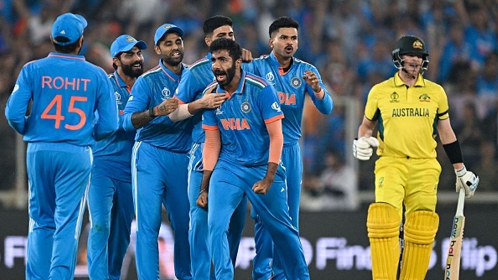 Jasprit Bumrah's one word reaction to India's win over Australia to reach Champions Trophy 2025 final goes viral India's Jasprit Bumrah (C) celebrates with teammates after taking the wicket of Australia's Steve Smith (R) during the 2023 ICC Men's Cricket World Cup ODI final match at the Narendra Modi Stadium in Ahmedabad on November 19, 2023.