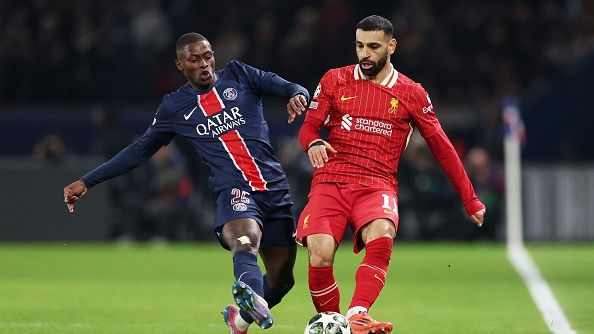 Liverpool vs PSG Live Streaming: How to Watch the Champions League Game in India, USA, UK, Saudi Arabia, and Australia? Mohamed Salah of Liverpool (R) passes the ball ahead of Nuno Mendes of Paris Saint-Germain during the UEFA Champions League 2024/25 Round of 16 first leg