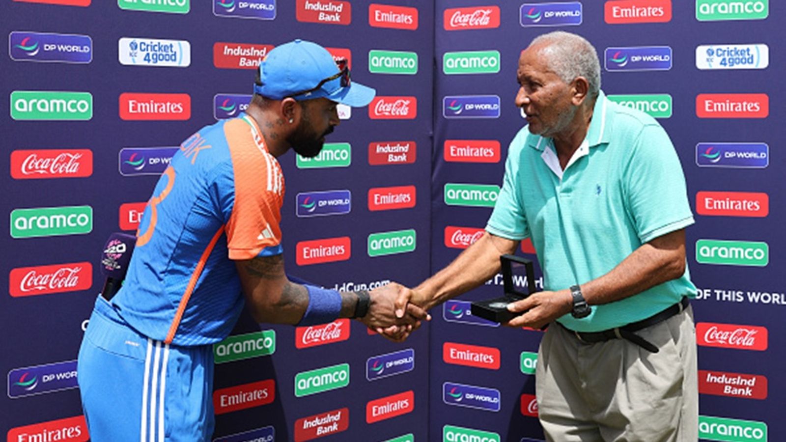 'To me, the ICC stands for the Indian Cricket Board': West Indies' legendary bowler Andy Roberts fumes at apex cricket council for allegedly favouring India Hardik Pandya of India (L) shakes hands with Sir Andy Roberts as he receives his Player of the Match trophy after the ICC Men's T20 Cricket World Cup 2024 Super Eight match against Bangladesh at Sir Vivian Richards Stadium on June 22, 2024 in Antigua.