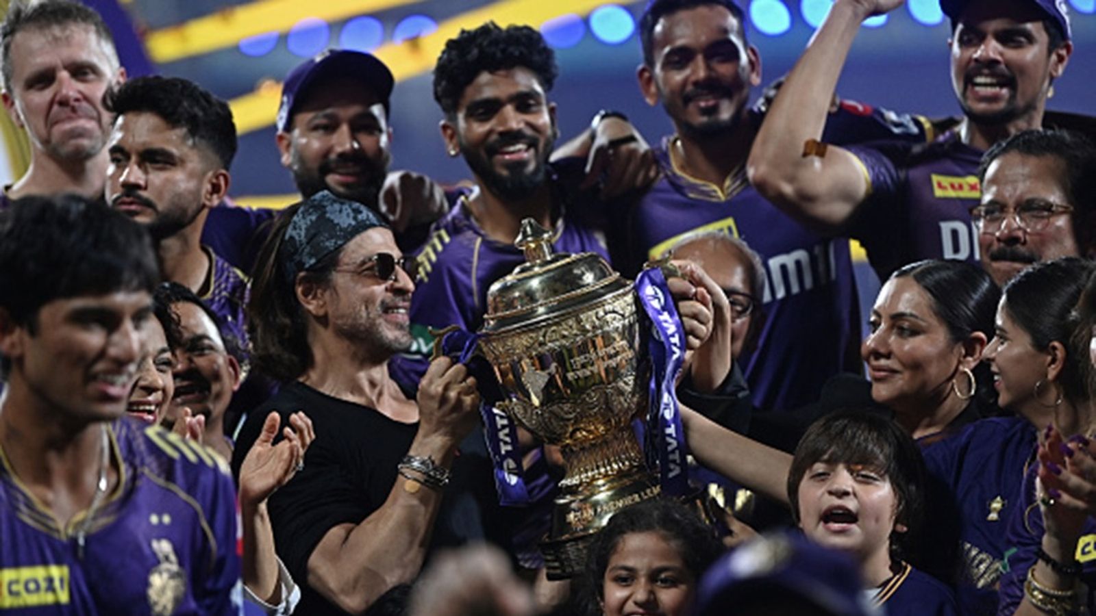 What is IPL's brand value on a global scale? Only one sports league in the world ahead of India's T20 extravaganza Bollywood actor and co-owner of Kolkata Knight Riders' team Shah Rukh Khan (C) poses with the trophy along with his family and team members after winning the Indian Premier League (IPL) final at the MA Chidambaram Stadium in Chennai on May 26, 2024.