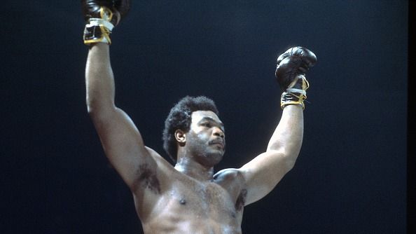 Heavyweight champion George Forman raises his arms after winning a boxing match circa 1973.