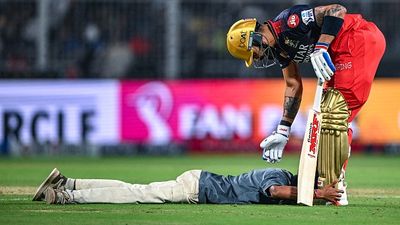 Virat Kohli's fan bears brunt for breaching security to touch RCB superstar's feet during IPL 2025 opener A fan breached security to touch Virat Kohli's feet during KKR vs RCB IPL 2025 clash