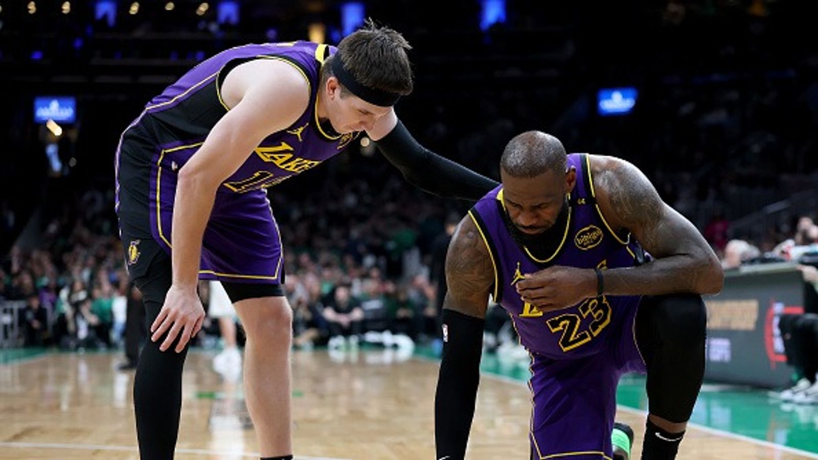 LeBron James Injury Report: Will the Lakers' Star Forward Play Tonight Against the Magic? Austin Reaves #15 of the Los Angeles Lakers checks on teammate LeBron James