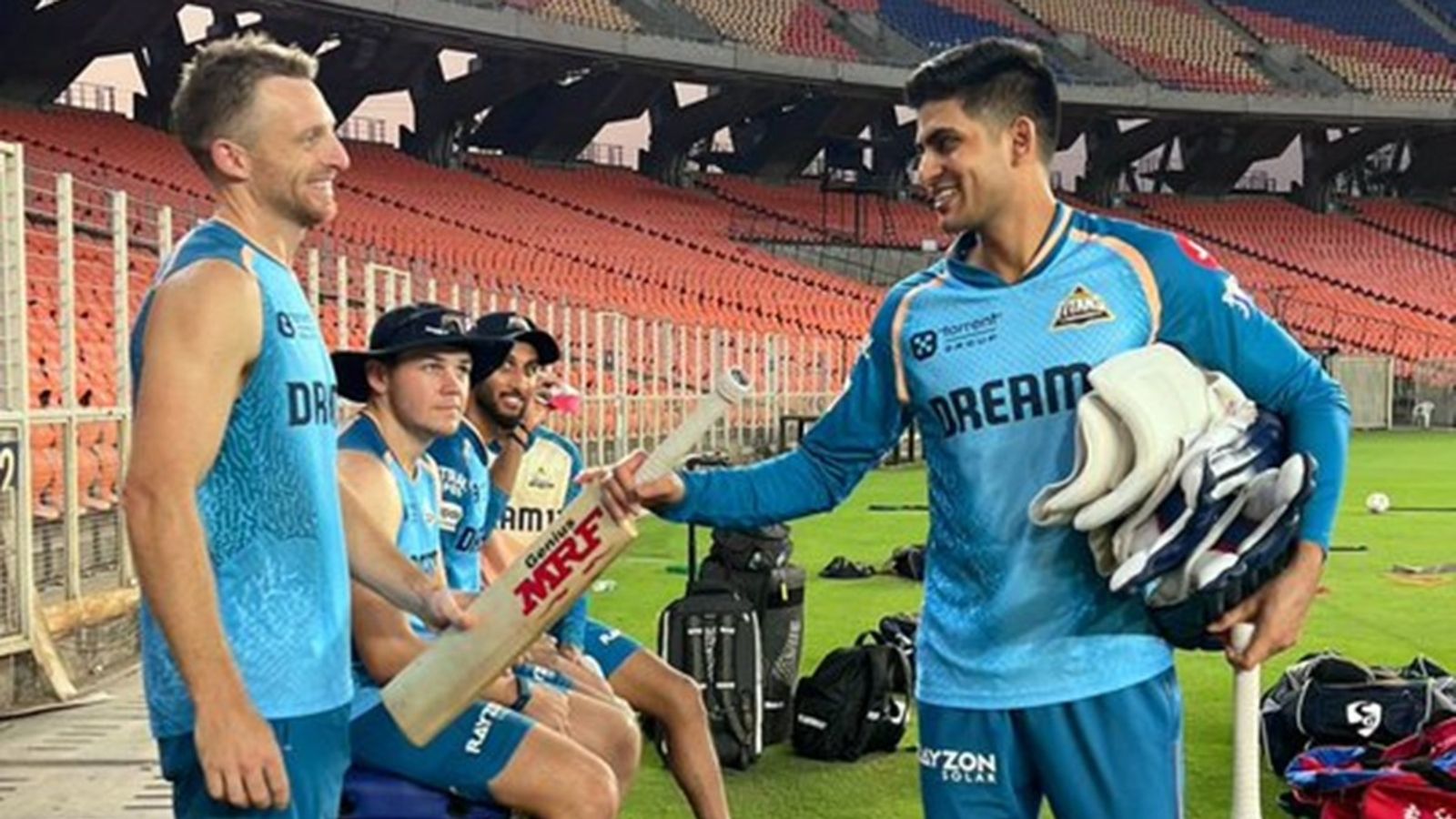 Jos Buttler not to open for Gujarat Titans? Shubman Gill says 'we haven't decided at which number he will bat' in surprising statement ahead of Punjab Kings match Gujarat Titans captain Shubman Gill gives his bat to Jos Buttler.