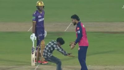 Fan invades Guwahati's pitch and touches Riyan Parag's feet during RR vs KKR IPL 2025 clash Fan invades pitch to touch Ryan Parag's feet