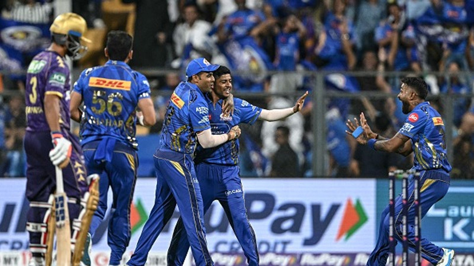 IPL 2025: Mumbai Indians return to winning ways, ride on debutant Ashwani Kumar's four-fer to annihilate Kolkata Knight Riders by eight wickets Mumbai Indians' Ashwani Kumar (2R) celebrates with his teammates in this frame