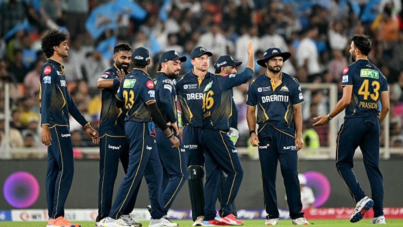 IPL 2025: Sudharsan's 82, Prasidh's 3-fer set up GT's thumping 58-run win over RR, record 4th straight victory GT's Prasidh Krishna (R) celebrates with his teammates during IPL 2025 clash against RR