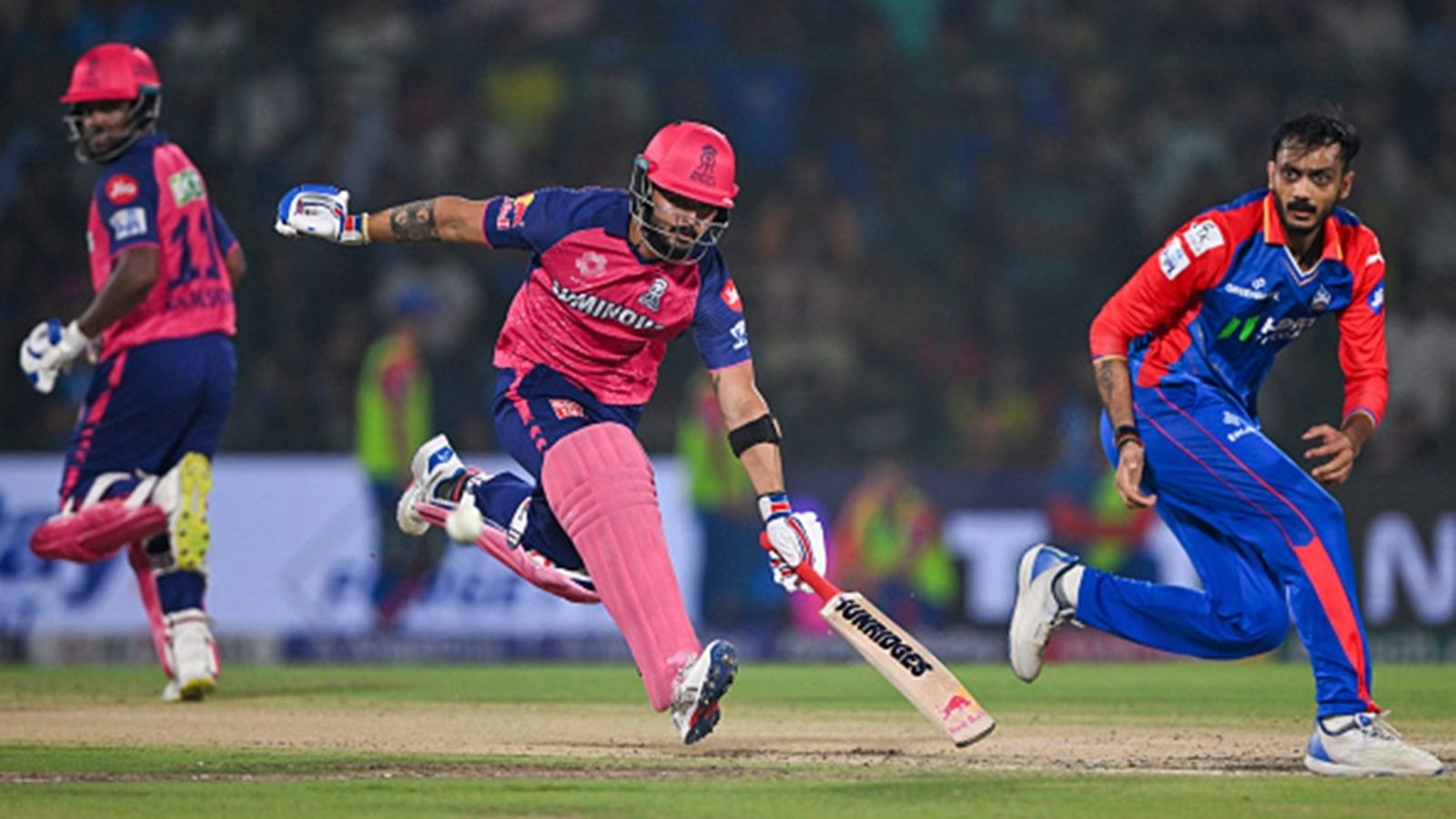 DC vs RR Match Prediction: Delhi Capitals dominant at home but Rajasthan Royals hold the edge clashes over the years Rajasthan Royals' Riyan Parag (C) and captain Sanju Samson (L) run between the wickets as Delhi Capitals' Axar Patel (R) looks on during the Indian Premier League (IPL) match at the Arun Jaitley Stadium in New Delhi on May 7, 2024.