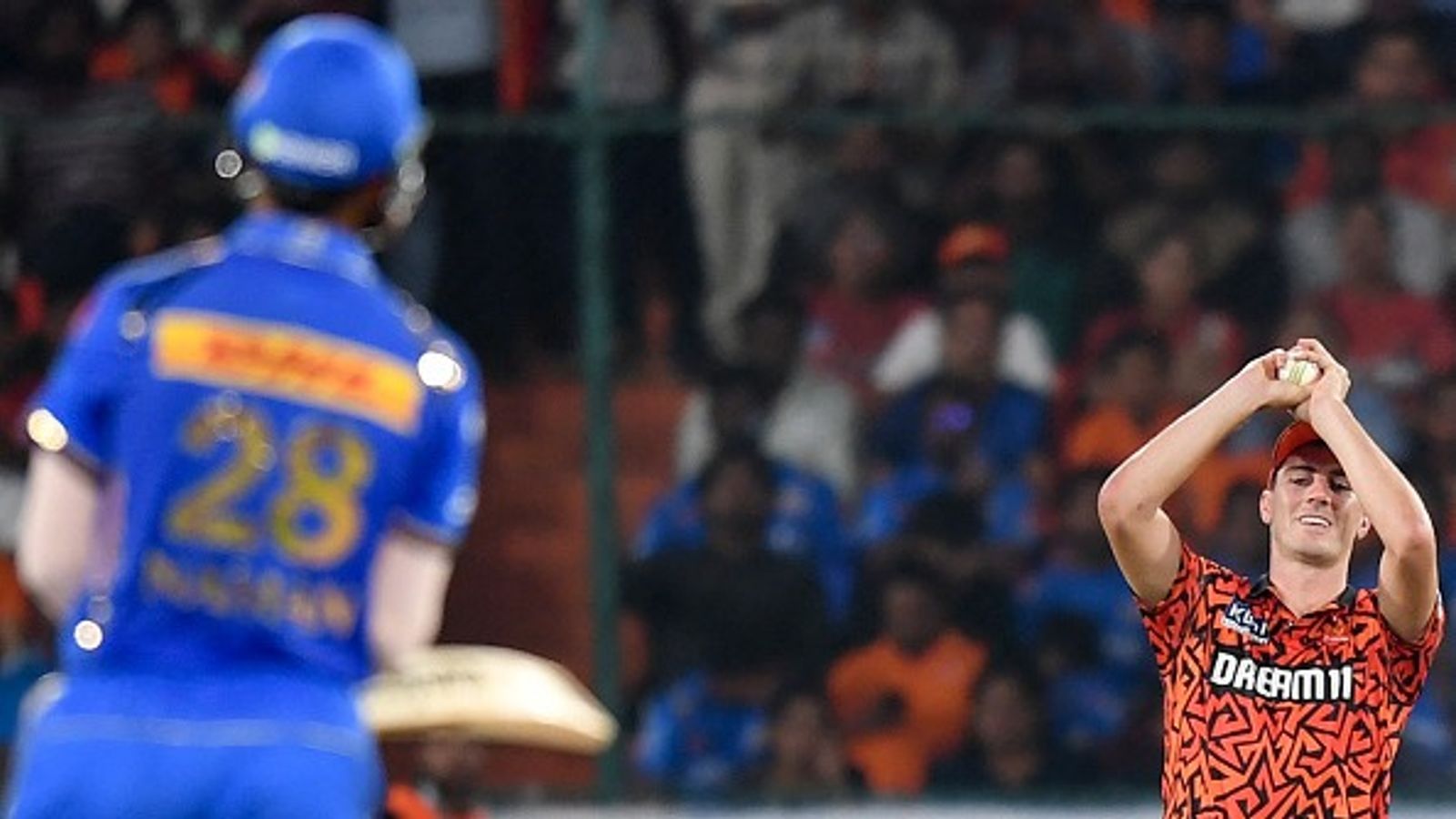 IPL 2025, MI vs SRH match prediction: Mumbai Indians hold the edge over Sunrisers Hyderabad over the years Sunrisers Hyderabad's captain Pat Cummins (R) takes a catch to dismiss Mumbai Indians' Naman Dhir during the Indian Premier League (IPL) Twenty20 cricket match between Sunrisers Hyderabad and Mumbai Indians