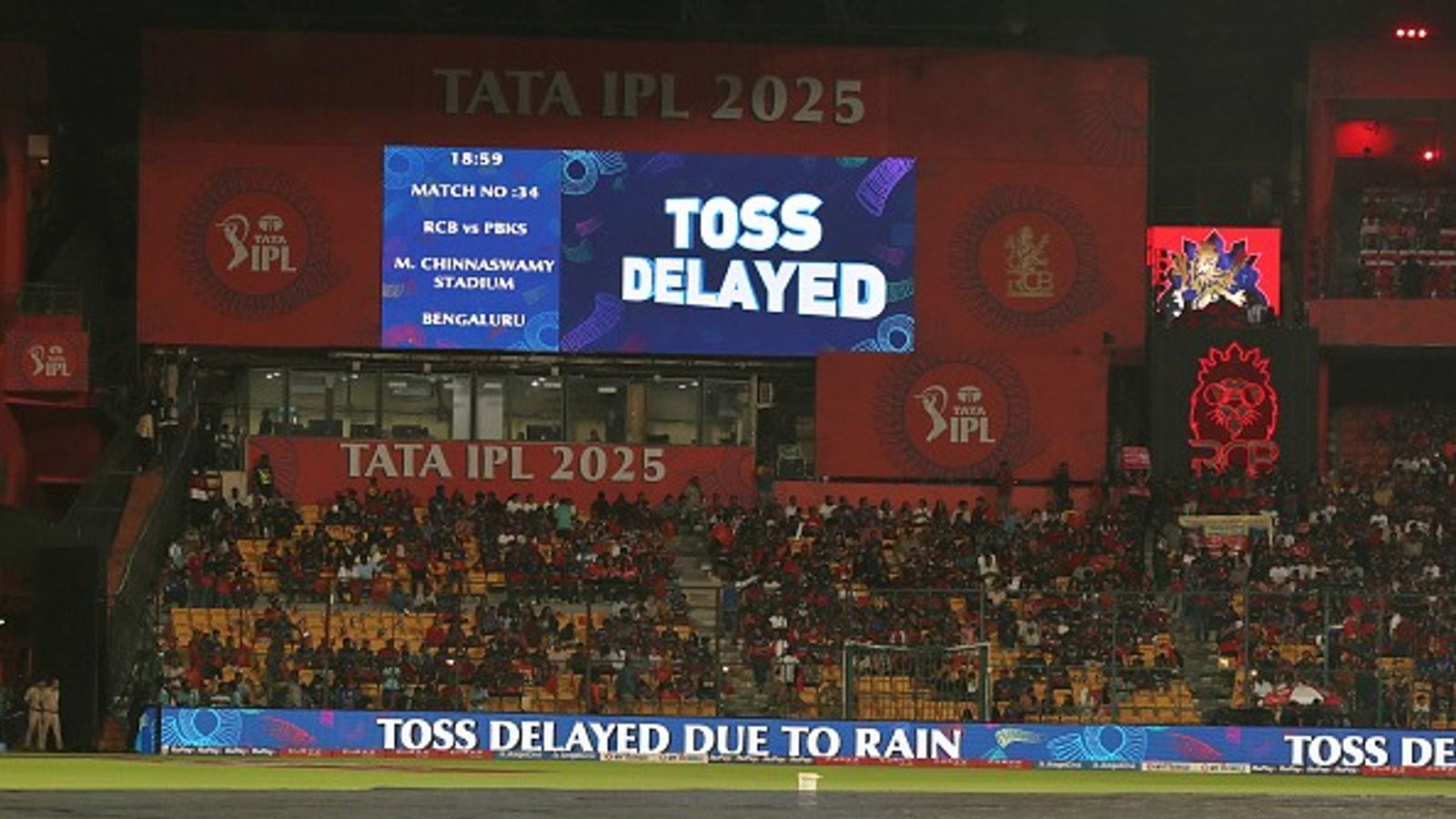 RCB vs PBKS IPL 2025: Toss delayed due to steady drizzle, know the playing conditions and cut-off time in rain-curtailed match Spectators wait as rain delays toss of the RCB vs PBKS IPL 2025 clash at the M Chinnaswamy stadium