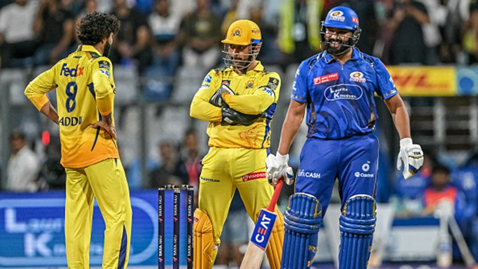 'Only advice left for CSK to...': Former India opener feels MS Dhoni-led side's season is over after 9-wicket loss to Mumbai Indians Chennai Super Kings' Ravindra Jadeja (L) and captain MS Dhoni (C) discuss taking the DRS for lbw against Mumbai Indians' Rohit Sharma (R) during the Indian Premier League (IPL) match at the Wankhede Stadium on April 20, 2025.